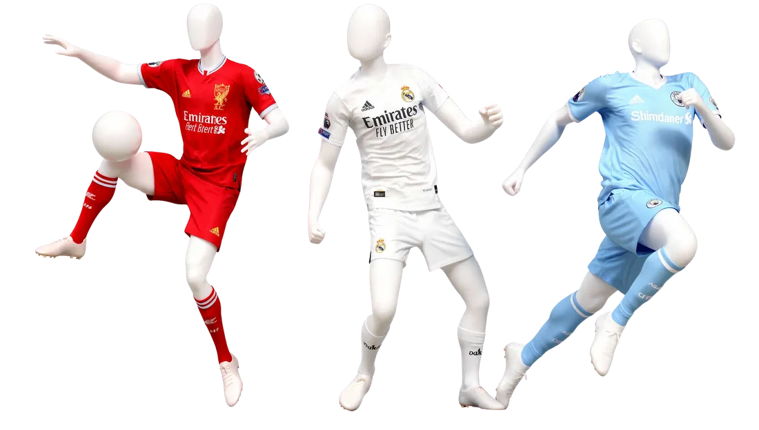 Three football figures in Liverpool, Real Madrid and Manchester City kits